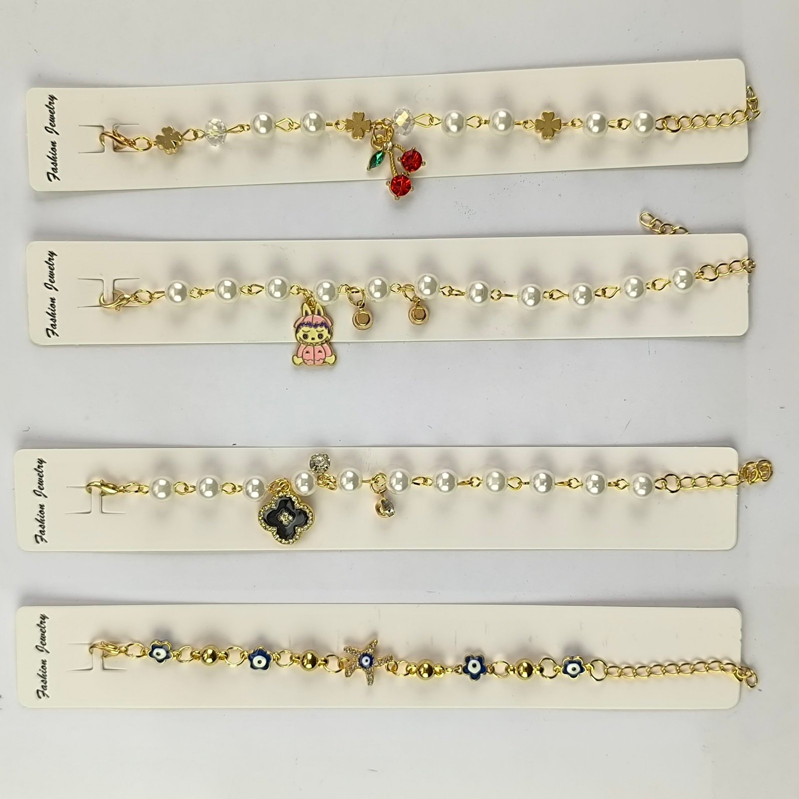 Pulseras con Perlas y Charms Colgantes Doradas para Mujer | Set 12 Piezas Modelos Surtidos con Dijes Kawaii, Ojo Turco y Cristales - Image 7